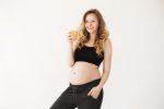 portrait o young good looking joyful pregnant woman with light hair comfy home clothes smiling holding glass orange juice hand ready start her day with tasty drink What to avoid during pregnancy days?