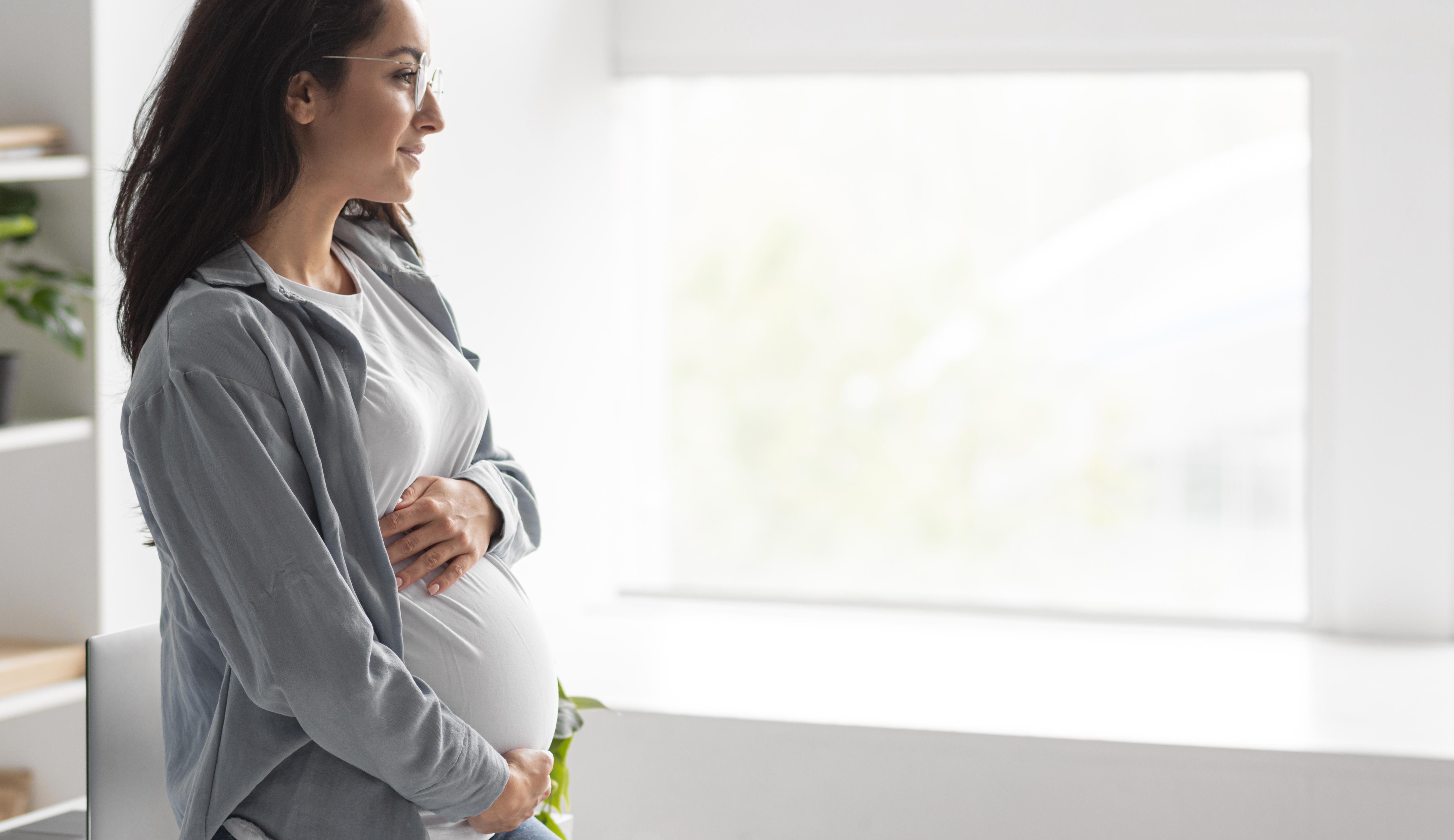 Tips To Tackle Gestational Diabetes 1 side view pregnant woman holding her belly home with copy space Tips To Tackle Gestational Diabetes